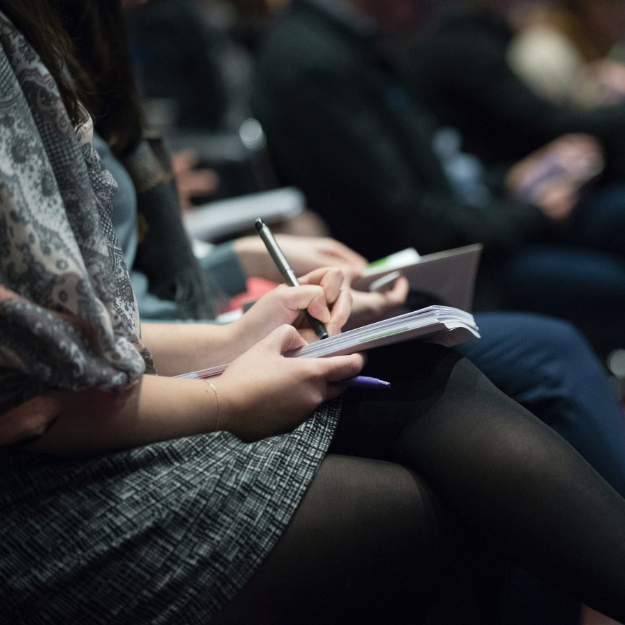 a person taking notes