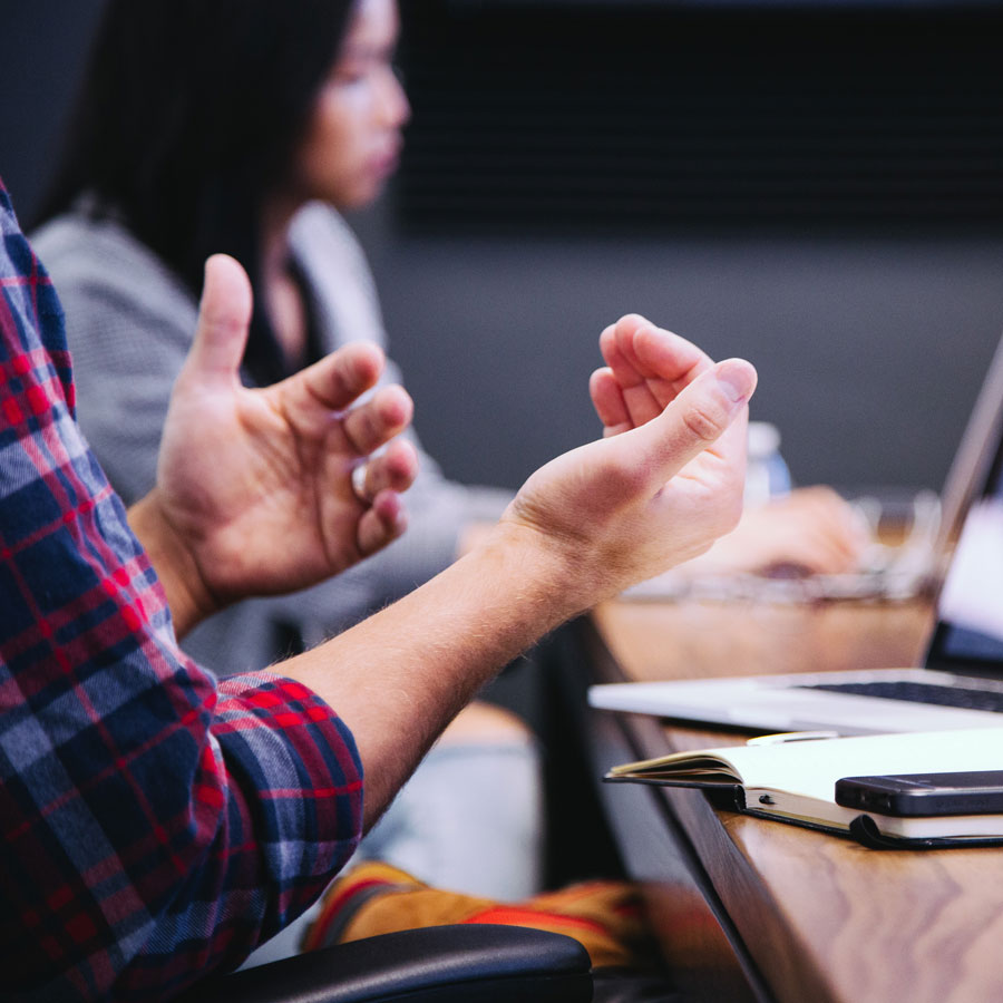 a person talking using hand gestures